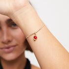 Charm with red stone